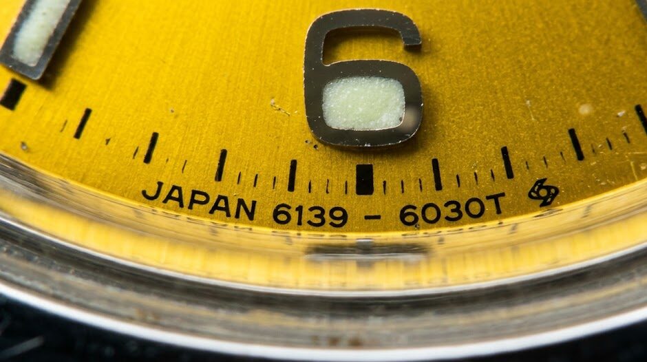 Seiko 6139-6002 Pogue dial macro highlighting the 6030T factory code and Suwa factory symbol